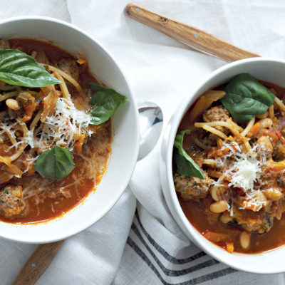 Herbed tomato-vegetable soup with spaghetti and meatballs