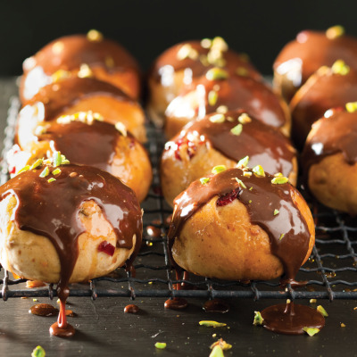 Cranberry and orange hot cross buns with milk chocolate drizzle