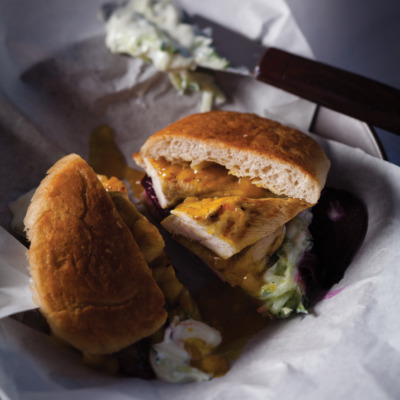 Grilled chicken burgers with tzatziki, mango chutney and beetroot