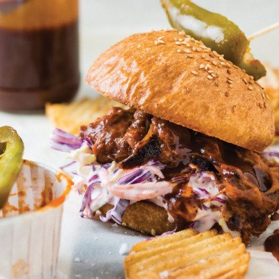 Pulled beef sandwich with coleslaw and crinkle-cut chips