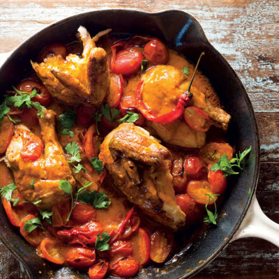 Rotisserie chicken and roast tomatoes in peri-peri sauce