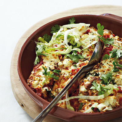 Baked beef and bean burritos with spicy tomato sauce, mozzarella and feta