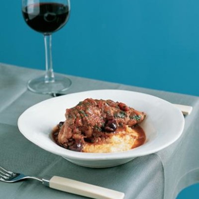 Braised chicken, tomato and olives on soft polenta