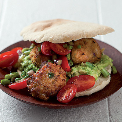 Chickpea falafel pitta breads on lemony avocado