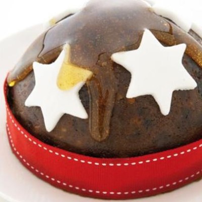 Classic Christmas pudding in honey ginger syrup