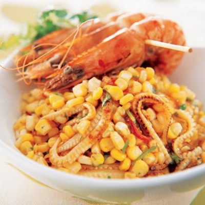 Corn stir fry with prawn skewers