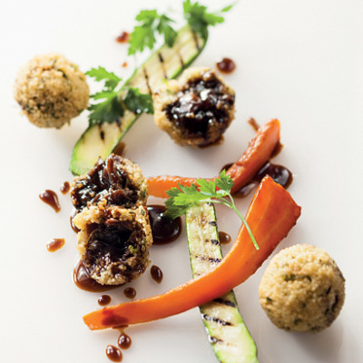 Couscous and lamb rib croquettes with roast carrots and baby marrow ribbons