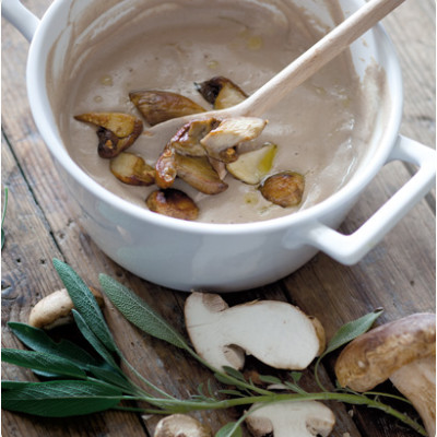 Creamed porcini soup topped with panfried mushroom