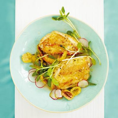 Crisp chicken breasts with oak-smoked salt, pan-fried garlic, sunflower sprouts and baby radish