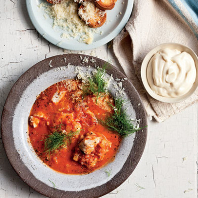 Fish soup with croutons, cheese and garlic mayo