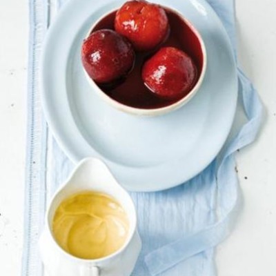 Fragrant plums poached in Cinzano and served with vanilla and nutmeg custard