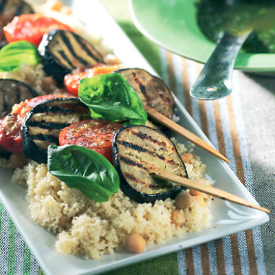 Grilled brinjal and tomatoes on couscous with garlic-basil broth