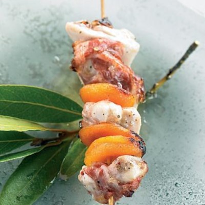 Grilled chicken, pancetta and dried apricot skewer