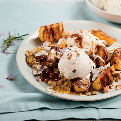 Grilled pineapple with rum and raisin ice cream, crumble and butterscotch sauce