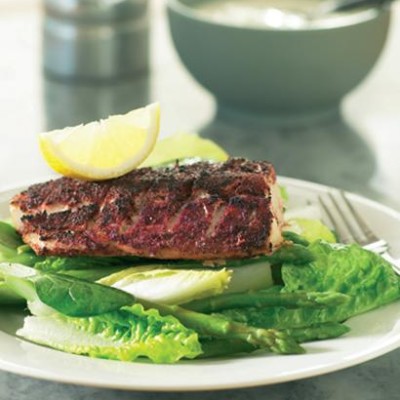 Grilled sumac-dusted fish on a big green salad