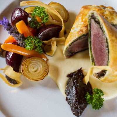 Klein karoo springbok wellington with parsnip puree, baby root vegetables and red wine jus