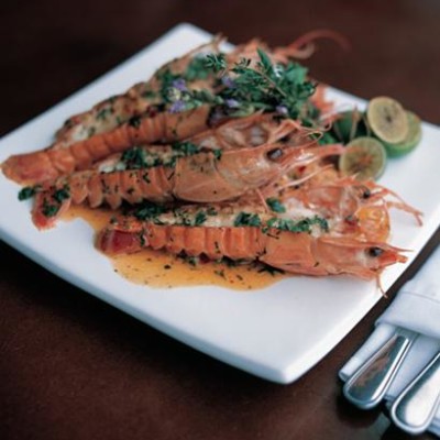 Langoustines in a spicy lemon butter sauce with rocket and parmesan salad