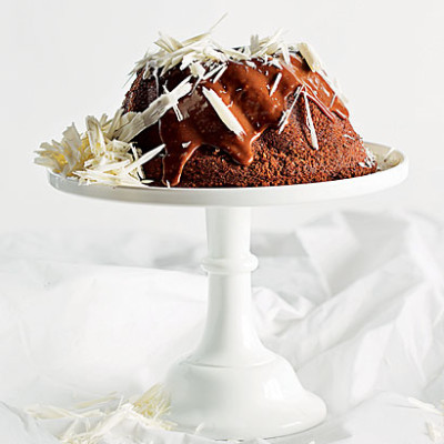 Nutty Wheat, sweet potato, orange and dark chocolate bundt cake with milk chocolate ganache and white chocolate shavings