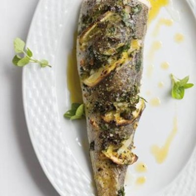 Oven-roasted hake stuffed with fresh herbs and zesty lemon