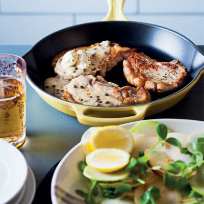 Pear-cider pork chops with kohlrabi, pear and pea shoot salad