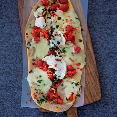 Pizza with ricotta and crushed cherry tomatoes