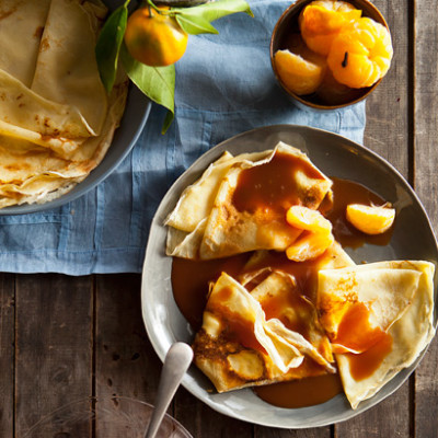 Poached-naartjie crepes with salted caramel sauce