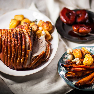 Pork leg roast with rosemary roast potatoes and crimson quinces