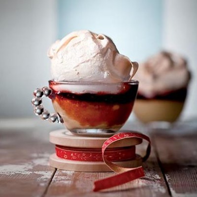 Queen of puddings with oozing raspberry jam