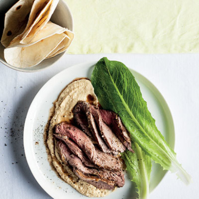 Roast Middle-Eastern-spiced lamb on hummus