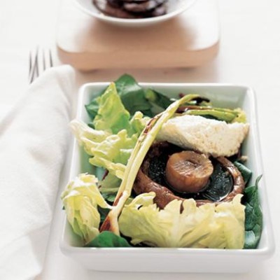 Roasted ricotta with mushroom steaks and spring onions