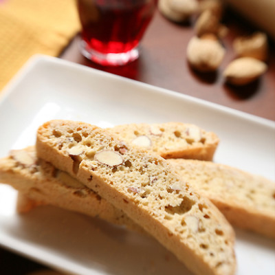 Rose-and cardamom-poached baby figs with chocolate biscotti and almond cream