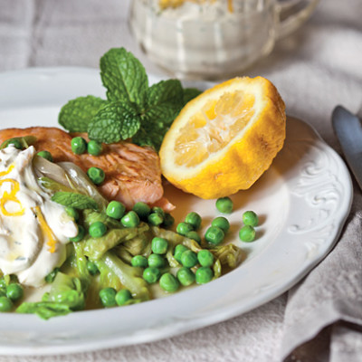 Salmon with wilted lettuce and pea salad and minted creme fraiche