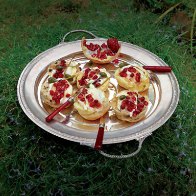 Scones with creme fraiche, pomegranate and caperberries