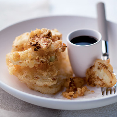 Tempura cauliflower discs with soy sauce dip