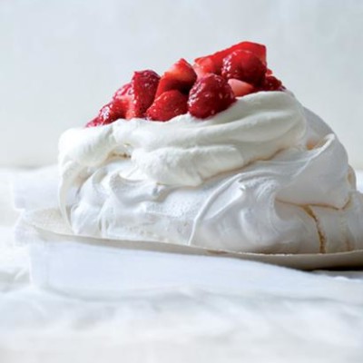 Traditional pavlova with berries and cream