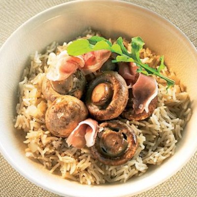 Whole mushroom pilaf with parma style ham and rocket