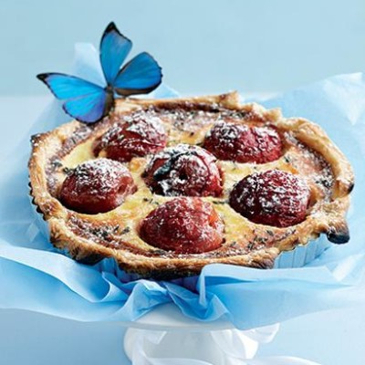 Whole plum and almond tart