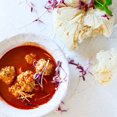 Steamed Zulu bread with chicken dumplings in harissa broth