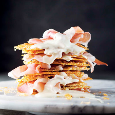 Grana Padano-crisp tower with Parma ham and white chocolate drizzle