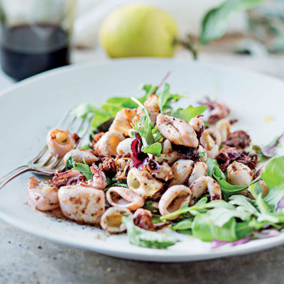 Lemony squid with baby leaves and bruschetta