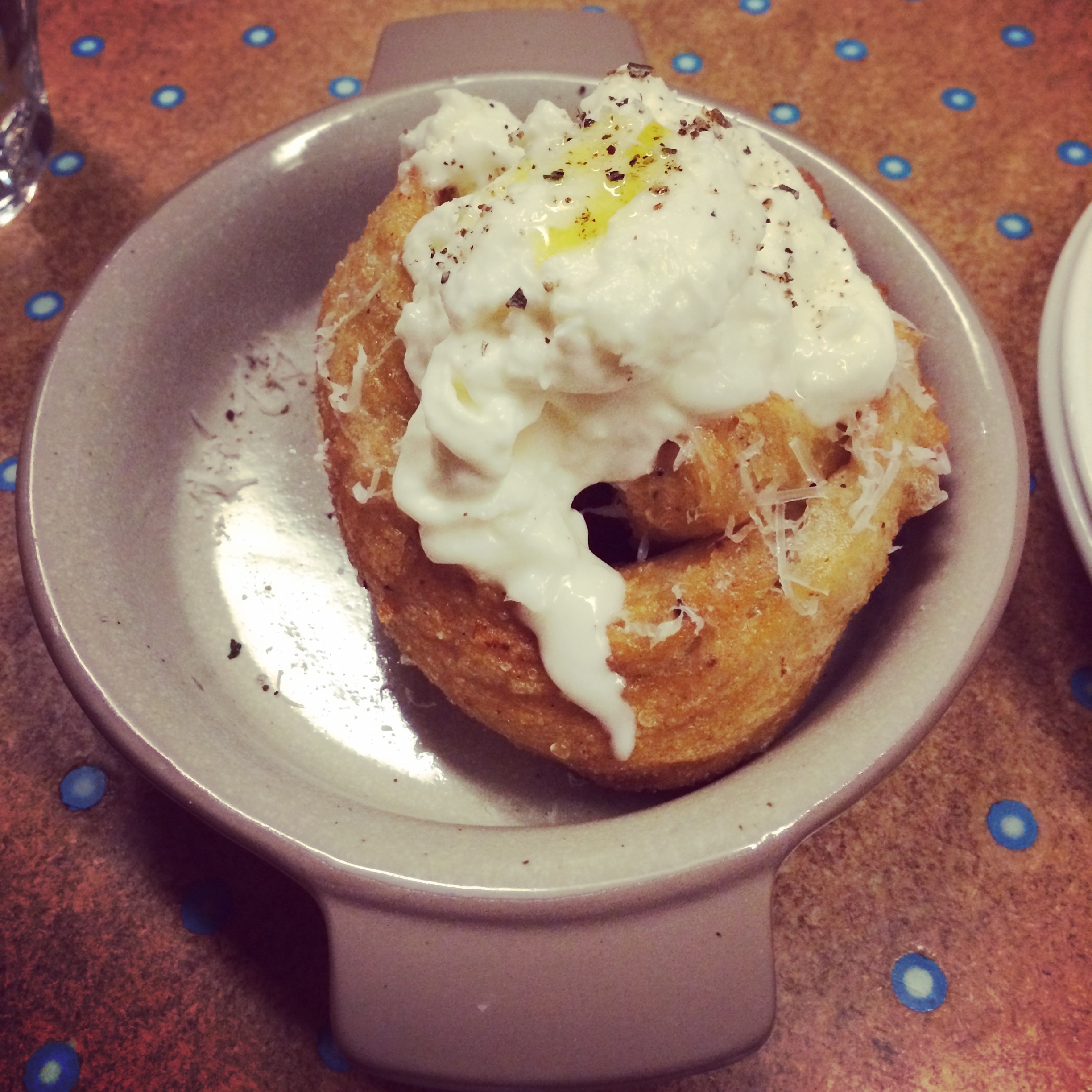 Fried green garlic bread with burrata, olive oil and Parmesan served off the State Bird Provisions dim sum trolley