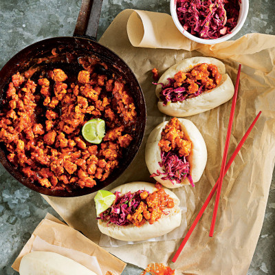 Spicy sriracha chicken sloppy Joes on steamed buns with fiery slaw