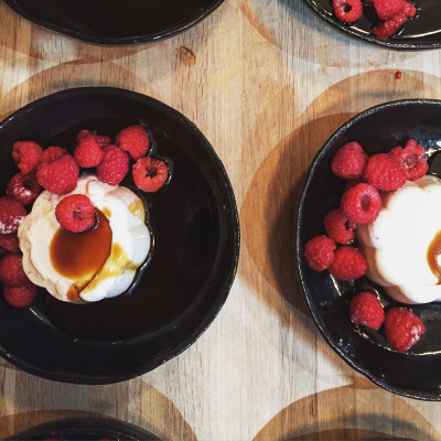 Rose and yoghurt panna cotta with coconut caramel and fresh berries