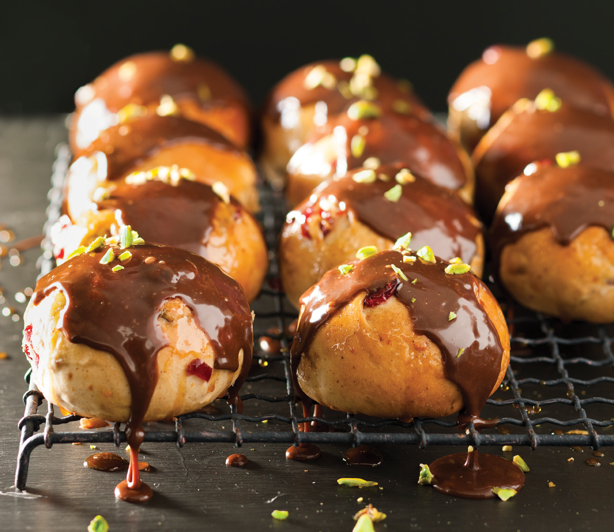 Cranberry and orange hot cross buns with milk chocolate drizzle