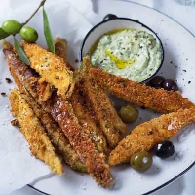 Parmesan-crumbed brinjal with marinated olives and basil pesto mayo