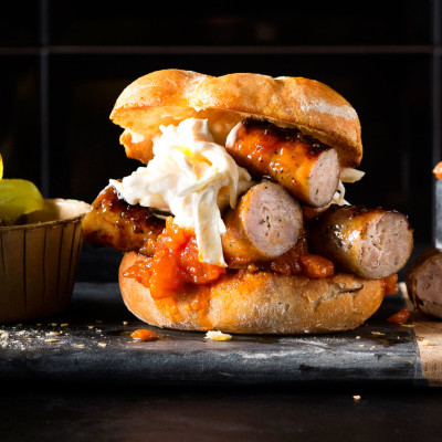 Spring onion-and-feta pork sausage burger with relish and celeriac slaw