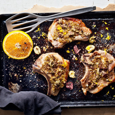 Baked pork chops with orange-olive paste