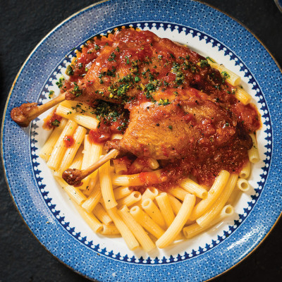 Braised duck leg with orange and tomato citrus gremolata