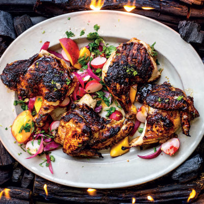 Korean chicken under a brick with radish-and-nectarine slaw