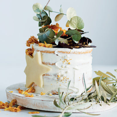 Meringue cake with cream cheese icing and caramel cornflake crown